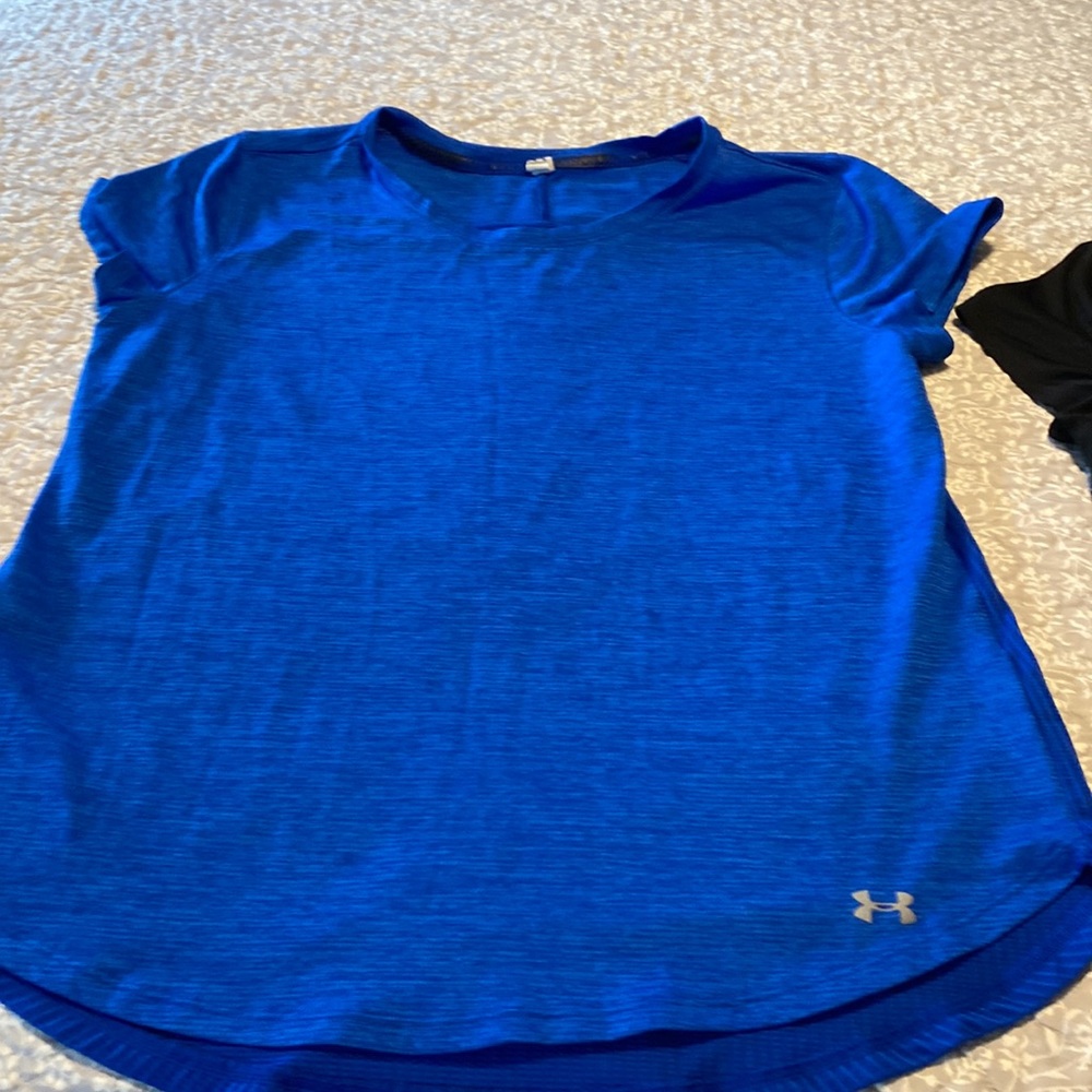 Two. Women’s under Armour shirts.